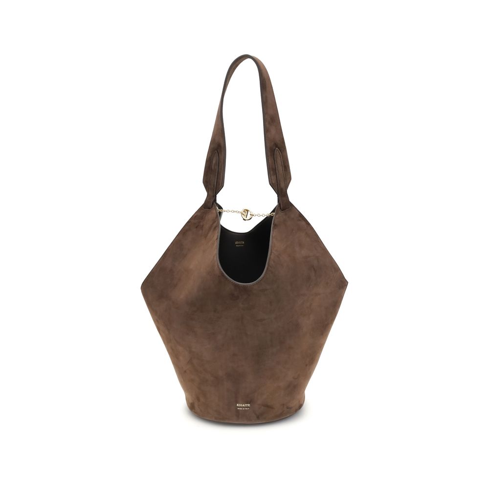 Brown suede handbag on a white background