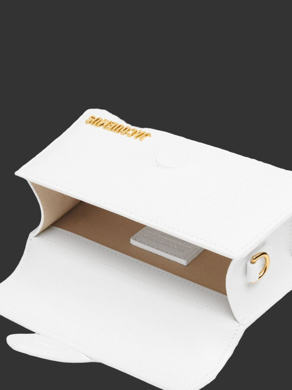 White gift box with gold text on a white background