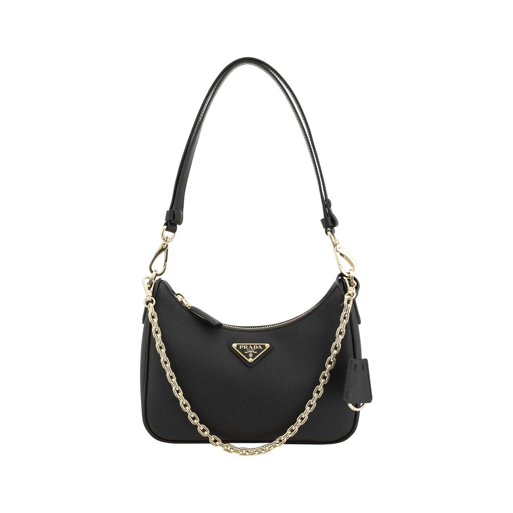 Black handbag with a gold chain strap on a white background