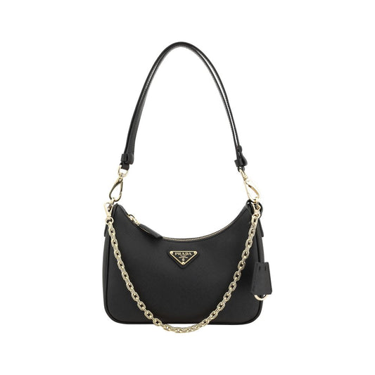 Black handbag with a gold chain strap on a white background